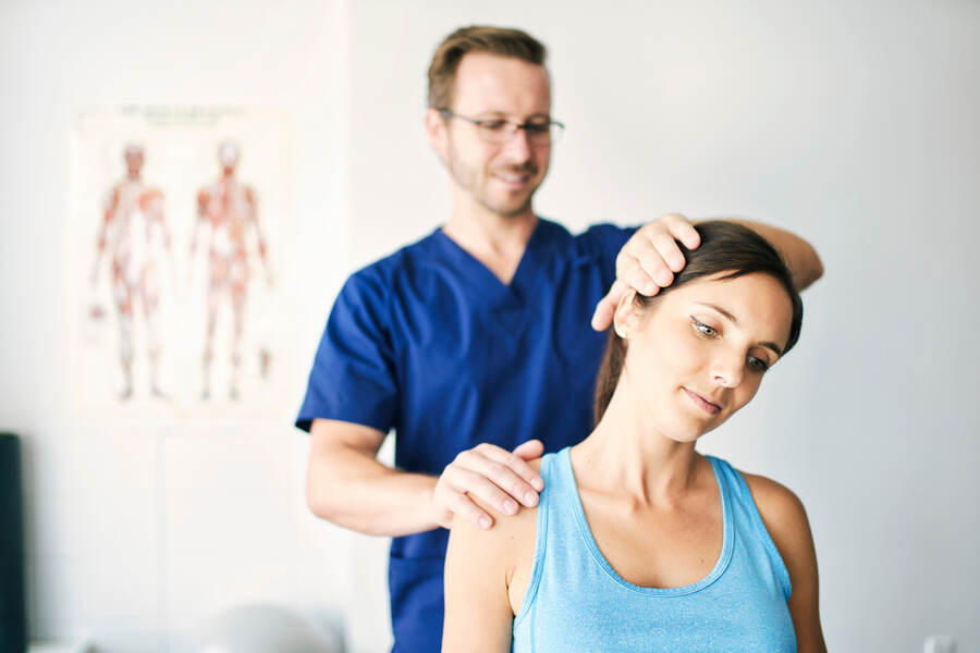 Chiropractor treating patient neck pain at High Amplitude Health in San Mateo, CA